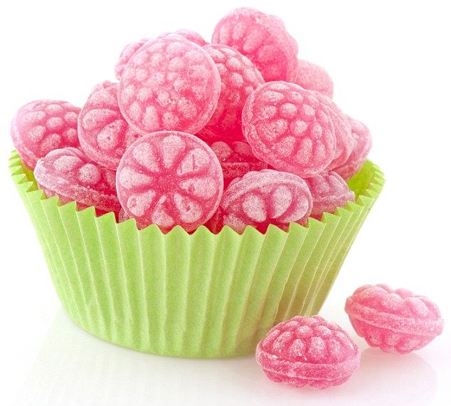 Raspberry tasty candy sweets in green cup cake paper; Shutterstock ID 55821241; PO: Dailymail; Other: good health